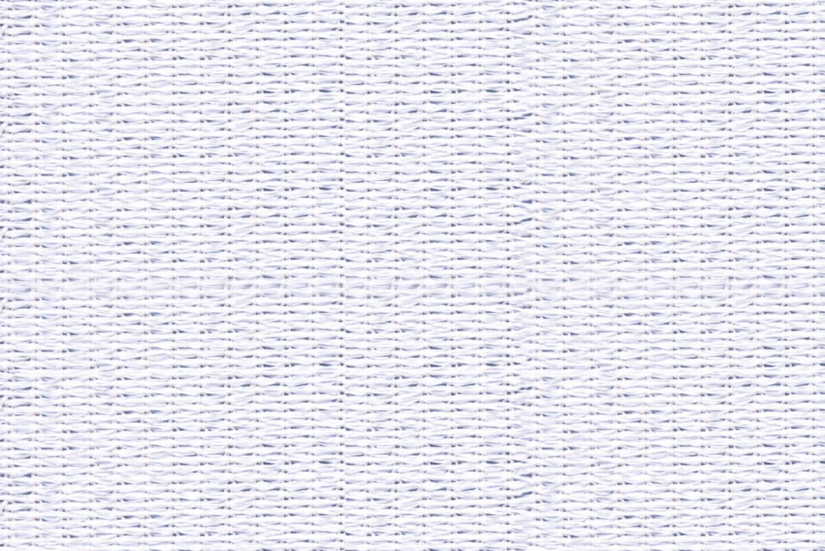 Λευκός υφασμάτινος τοίχος με λεπτές ραφές, κατάλληλος για διακόσμηση και εσωτερική διακόσμηση.